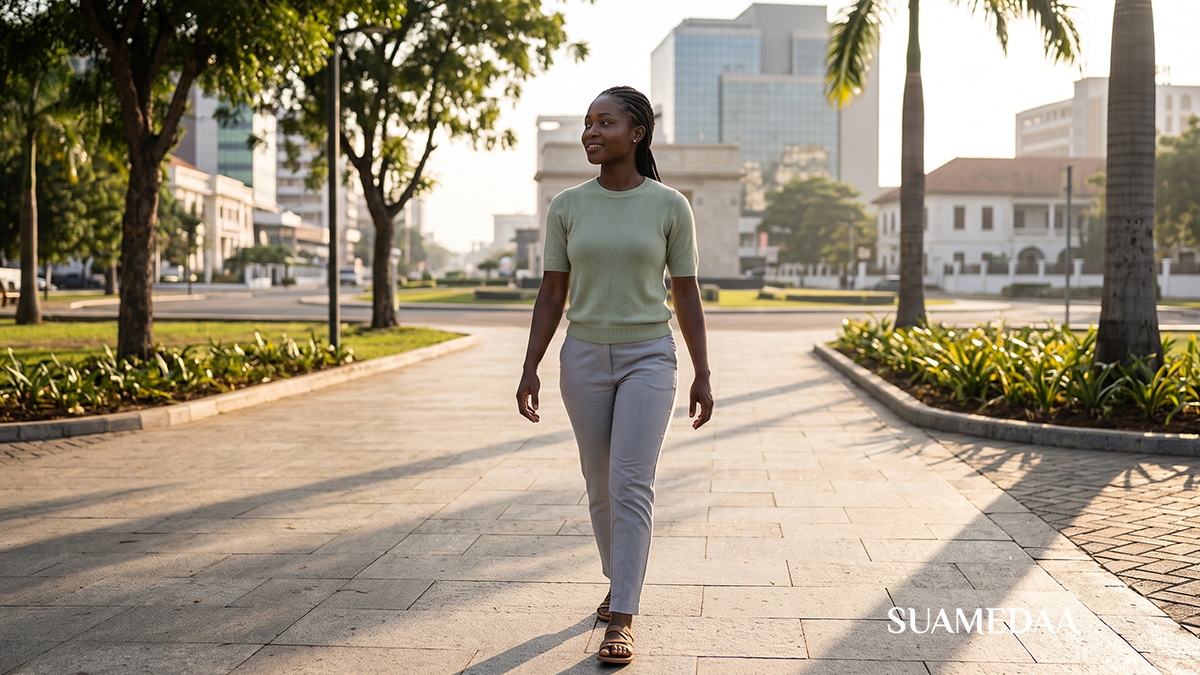 Lone-traveller-walking-along-a-sunlit-city-street